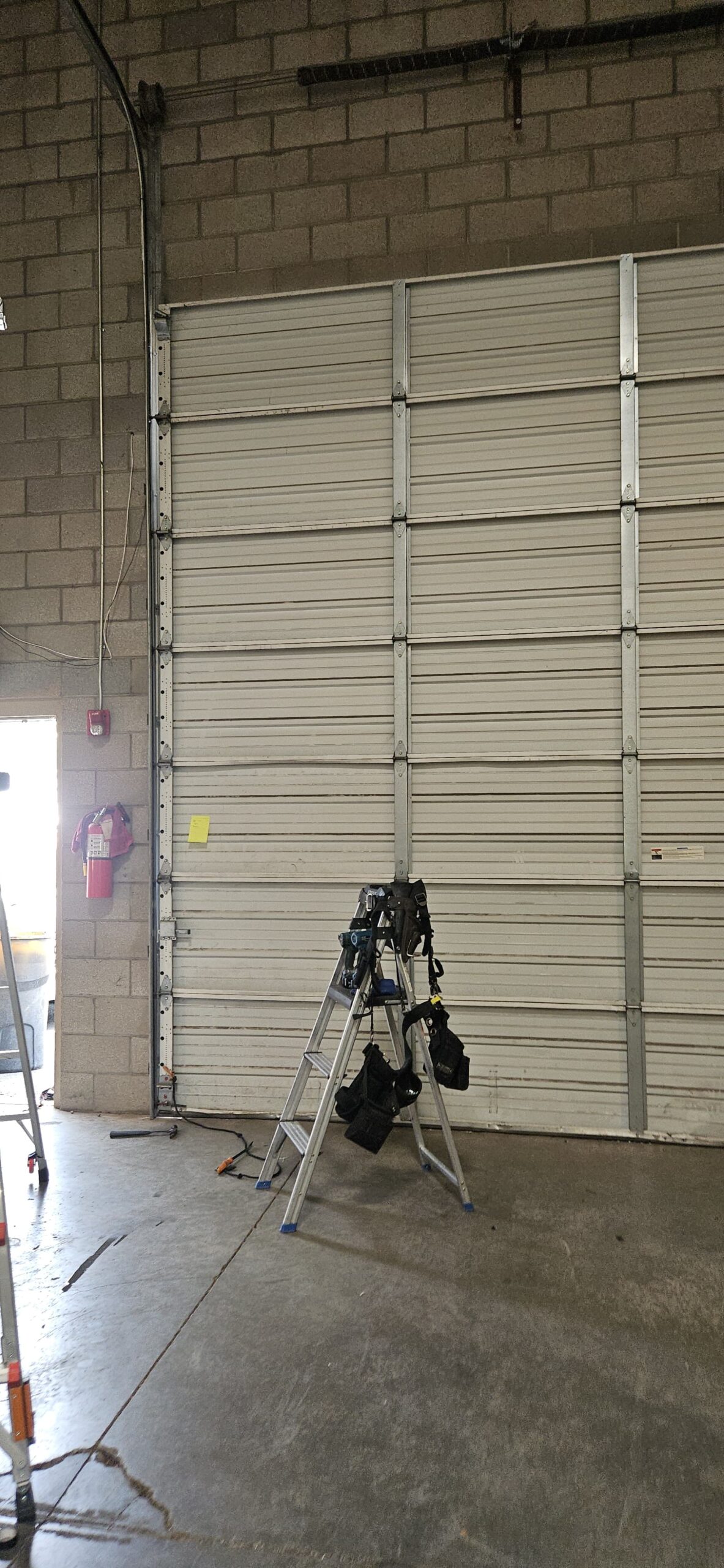 Commercial garage door after bracket and roller replacement in Goodyear Arizona