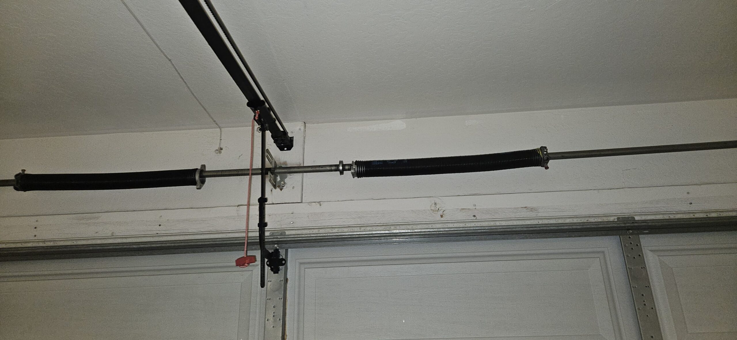 Broken garage door spring before replacement on W Joblanca Rd in Avondale