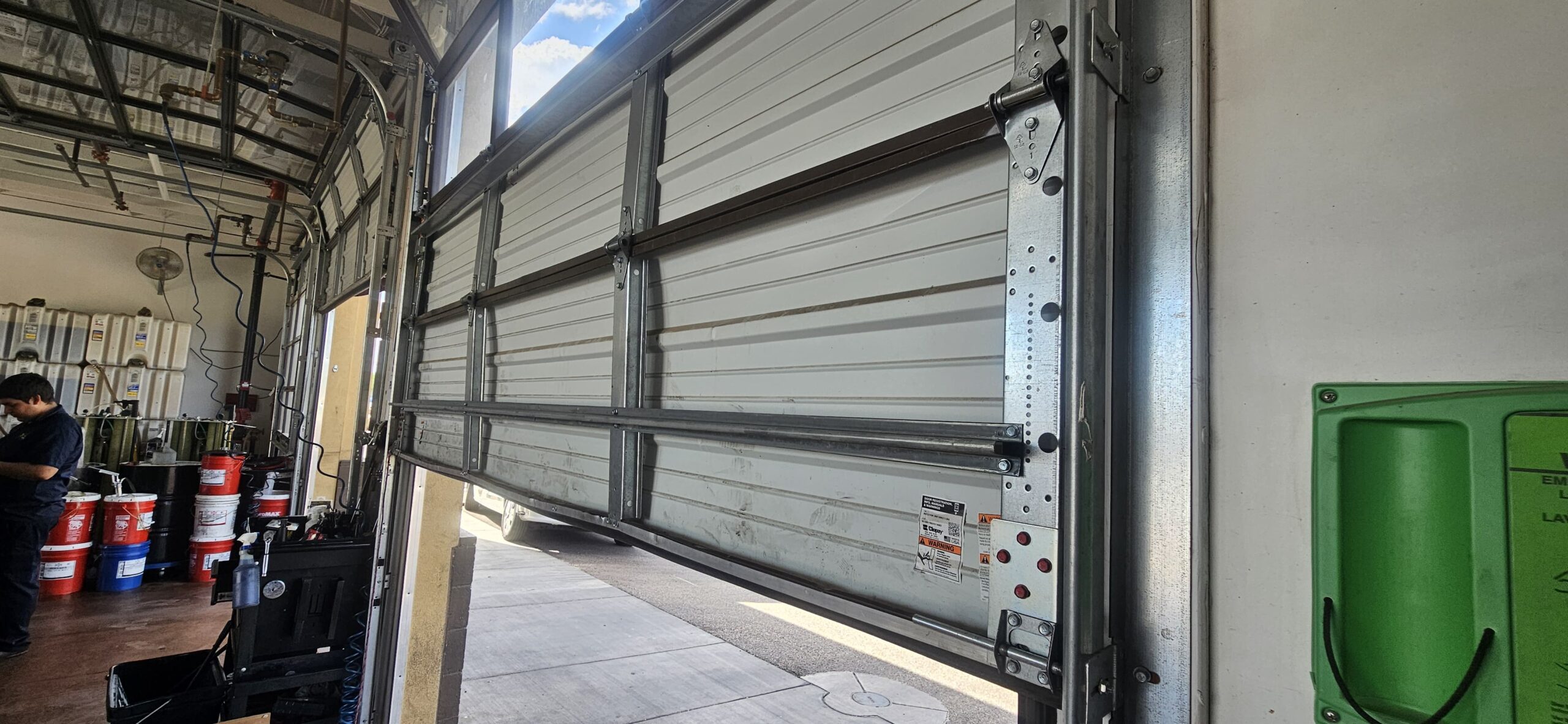 Commercial garage door after bottom panel reinforcement at Take 5 Oil Change