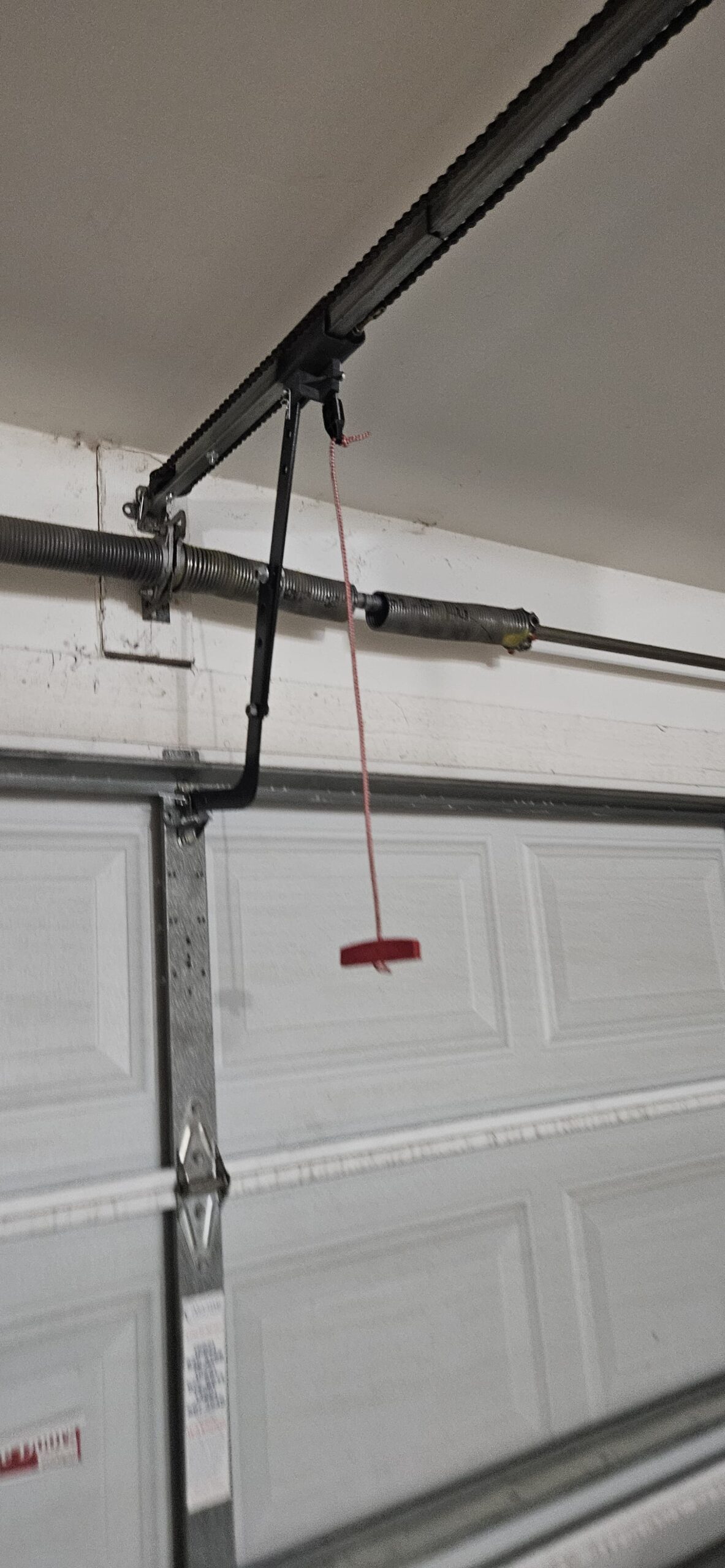 Broken garage door spring before replacement on W Windsor Ave in Avondale Arizona