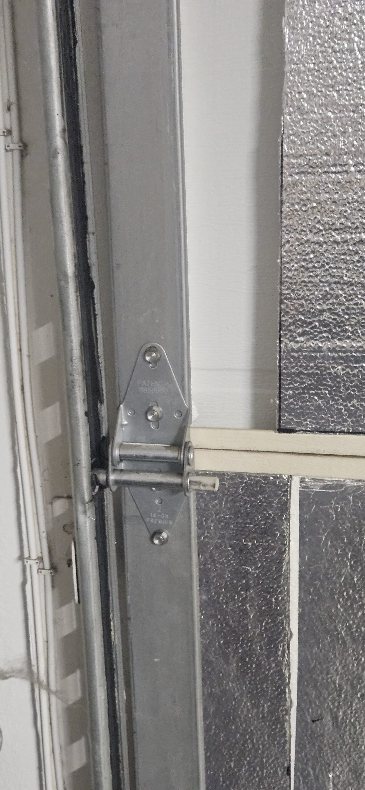 Garage door rollers back in place after alignment in Avondale