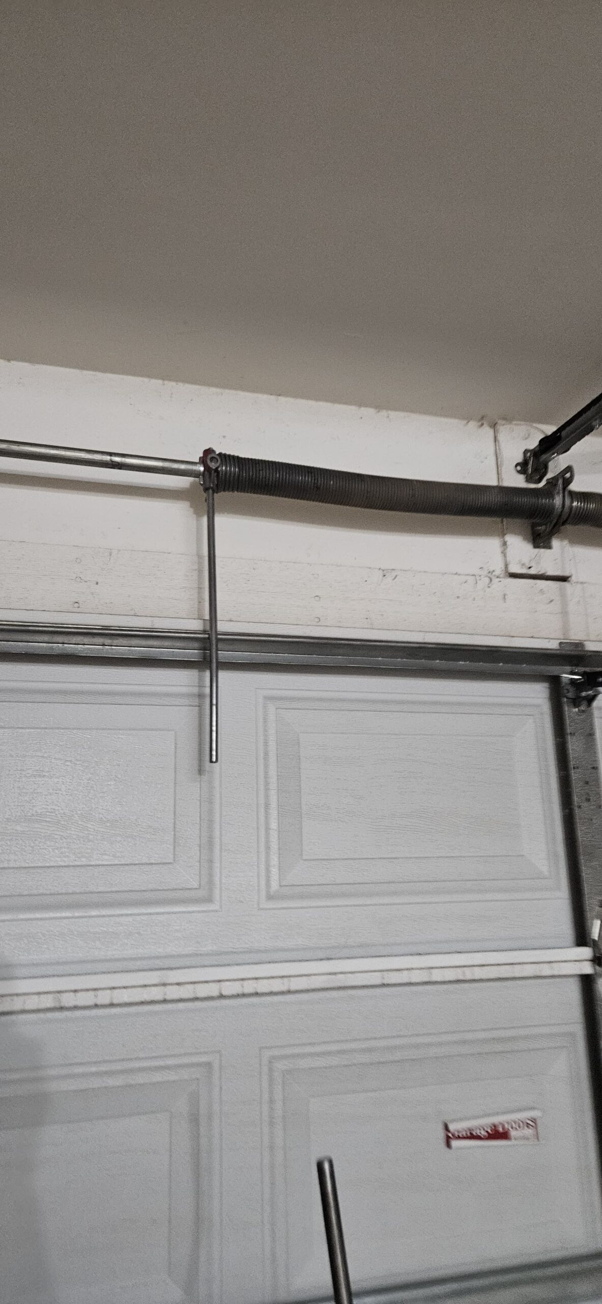 Garage door spring system during repair at an Avondale Arizona home